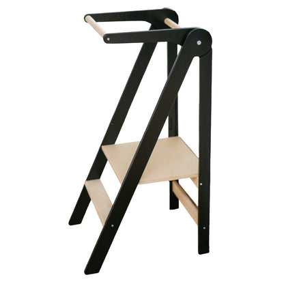 Natural wood kitchen tower leaning against white kitchen base cabinet showing lightweight foldable construction