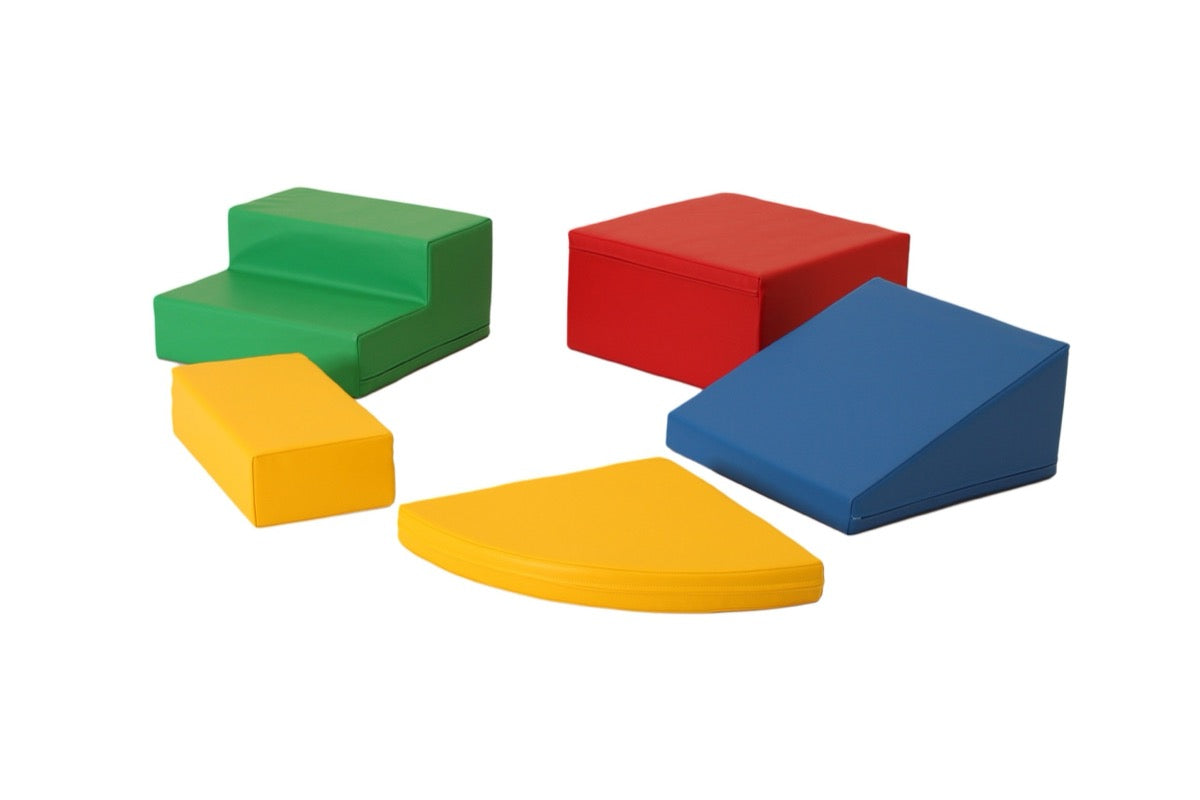 IGLU foam block corner climber with green, yellow, red and blue pieces on white background