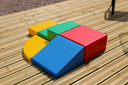 Angled view of multicolor foam corner climber on wooden outdoor deck