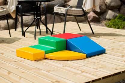 IGLU five-piece foam block set displayed on wooden patio with furniture nearby