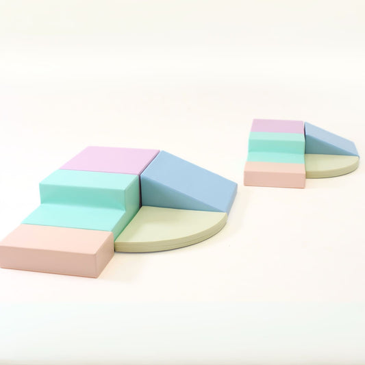 IGLU foam block set with five pastel-colored pieces arranged in corner climber configuration