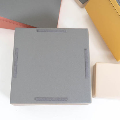 Top view of gray foam block showing fabric handles and non-skid bottom surface