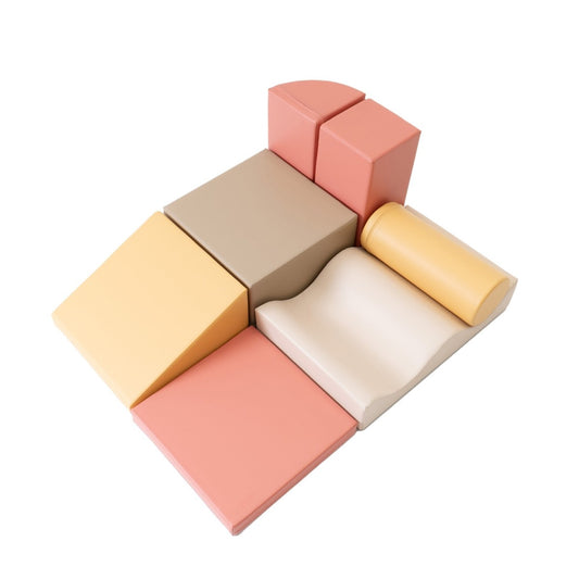 IGLU Discoverer 7-piece foam block set in pastel pink, beige, gray and cream arranged in a playset configuration