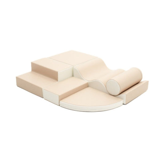 Beige foam block set with ramps, steps, and cylinder roller for soft play climbing