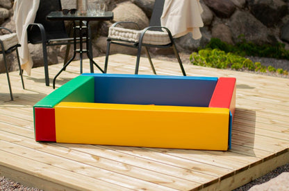 IGLU multicolor soft foam ball pit outdoors on wooden terrace – toddler play equipment
