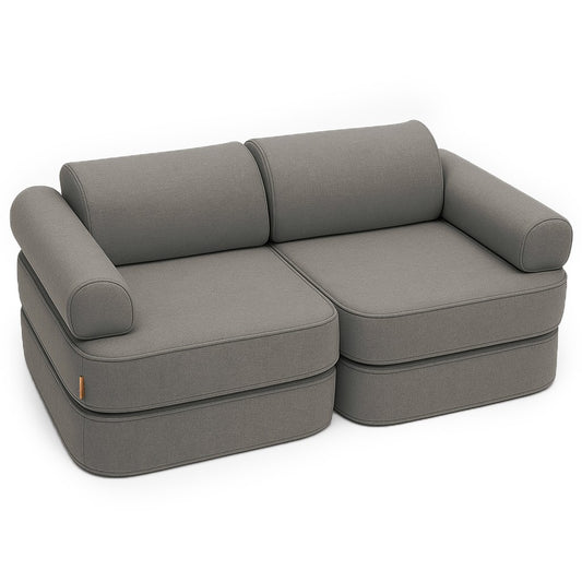 Clay taupe modular children's sofa with cushioned segments and rounded armrests arranged as a lounge