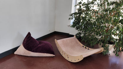 Two color variants of Luula kids bean bag chair in berry and mousse displayed