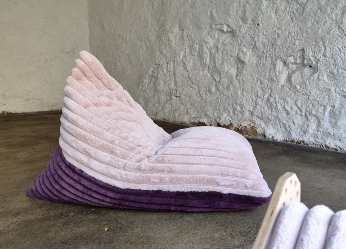 Side view of berry and rose duotone kids bean bag chair showing plush texture