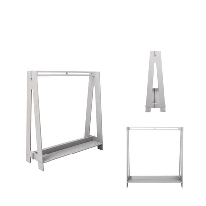 Disassembled grey and white kids clothing rack parts showing frame and shelf components