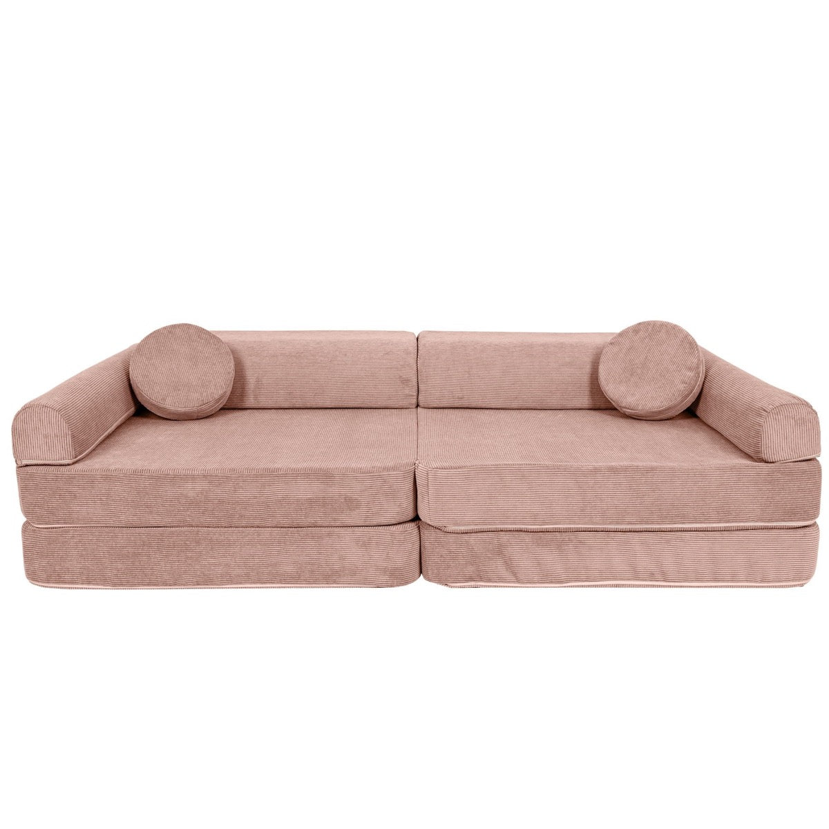 Pink modular kids sofa assembled in couch configuration with round arm pillows