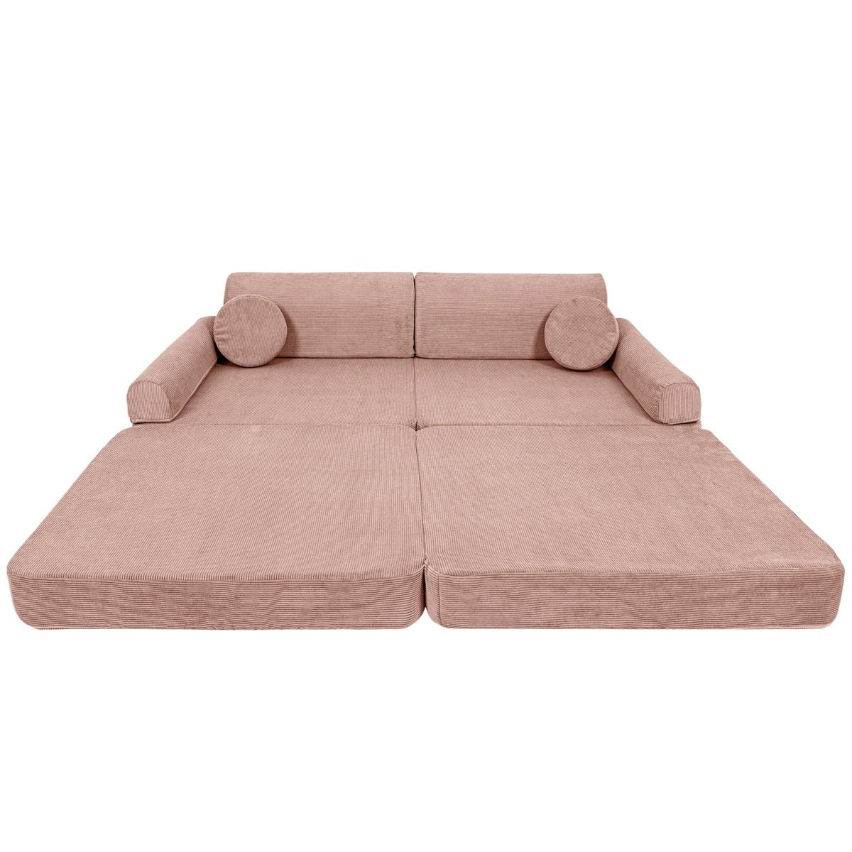 Pink modular sofa assembled as flat bed platform with round armrest pillows
