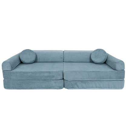 MeowBaby modular sofa in turquoise slimcord, front view with two cylindrical pillows