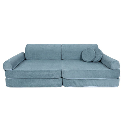 MeowBaby turquoise modular sofa side angle showing one cylindrical pillow and armrests