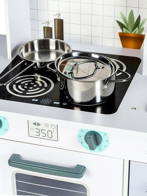 Stainless steel pot and frying pan on black stovetop with temperature display and control knob