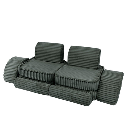 Forest green modular kids sofa with two seats and cylindrical armrests, angled side view