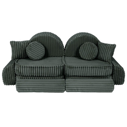 Forest green kids sofa front view with rounded armrests, cushions and cylindrical bolsters