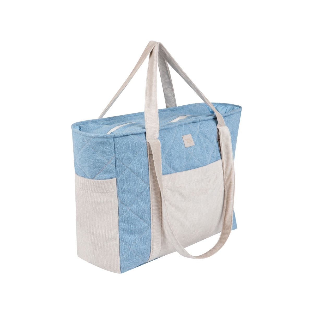 Jeans mom weekender bag shown at an angle with cream handles and visible outer pockets