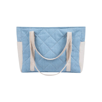 Top-down view of jeans weekender bag with quilted design and cream cotton handles