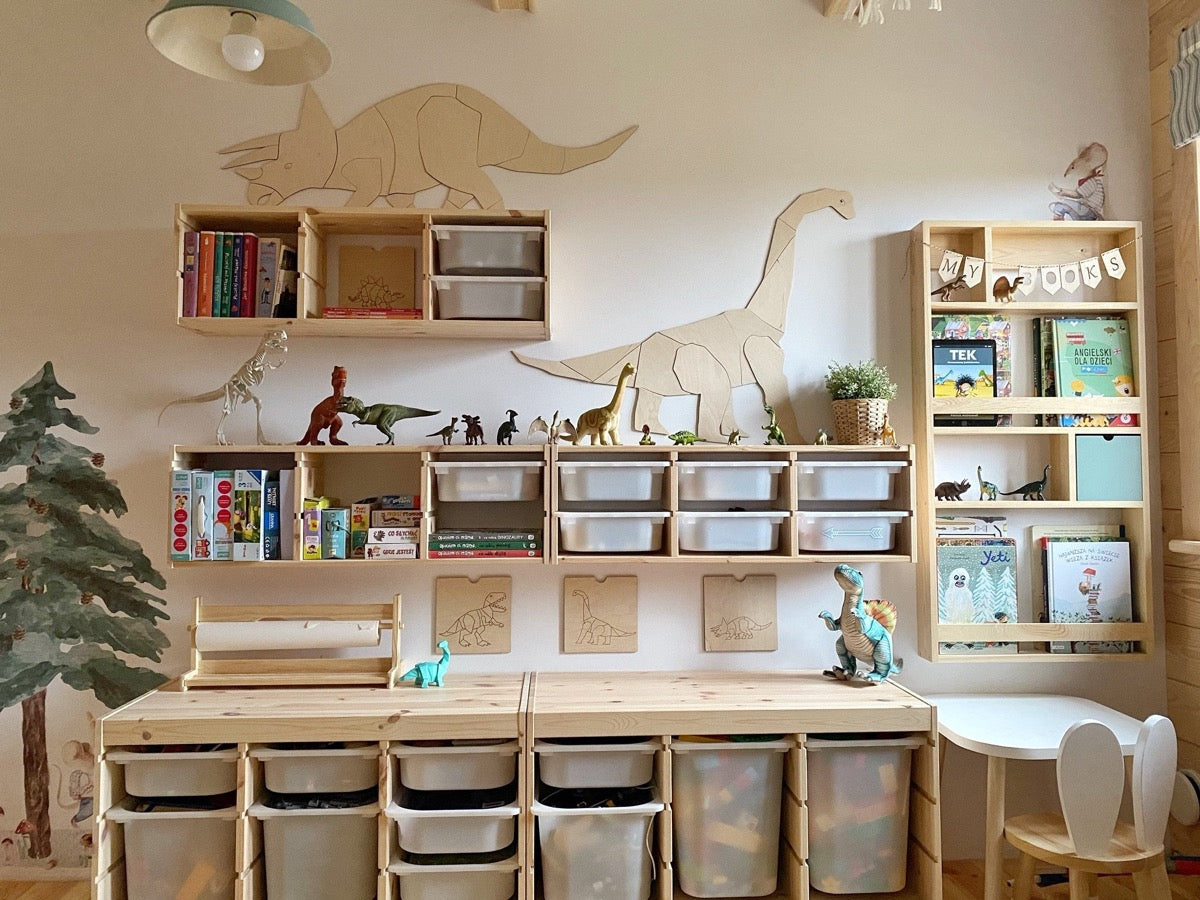 Wooden diplodocus wall art installed across playroom storage unit in organized kids space