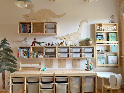 Wooden diplodocus wall art installed across playroom storage unit in organized kids space