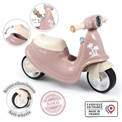 Pink retro scooter features underseat storage, soft wheels, and made in France badge