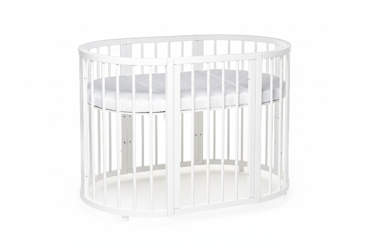 Round baby crib OLIN showing open side panel and mattress base