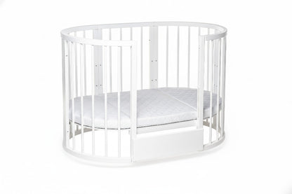 White beech wood round crib in closed crib mode with full protective barrier for newborns