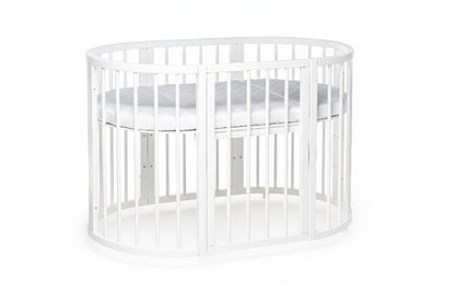KOTTO round crib with two vertical slat sections displaying modular conversion capability