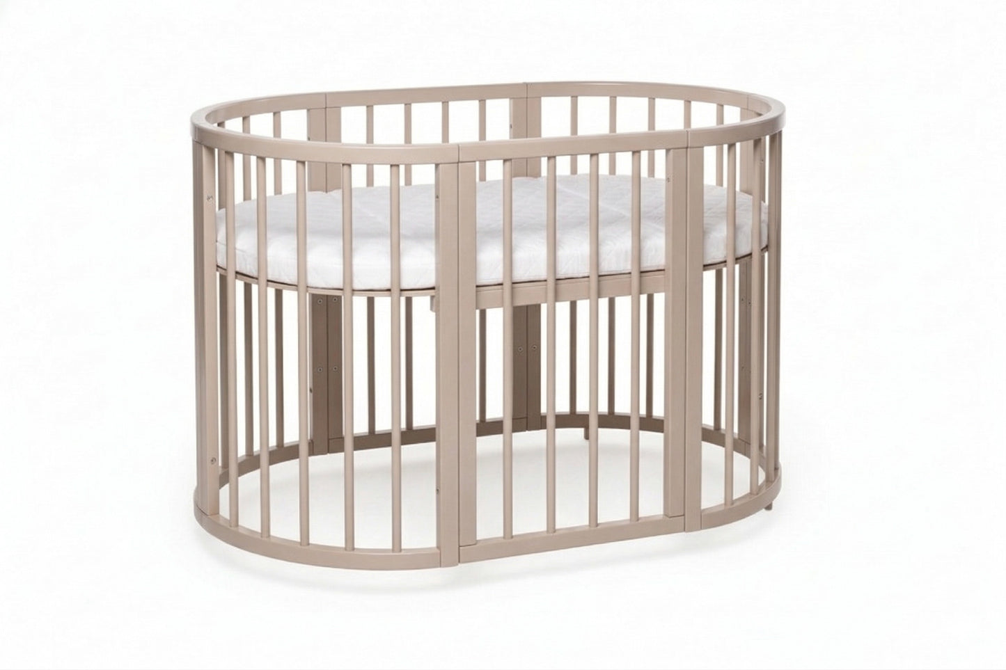 Oval OLIN baby crib with removable side panel and adjustable mattress base in natural wood