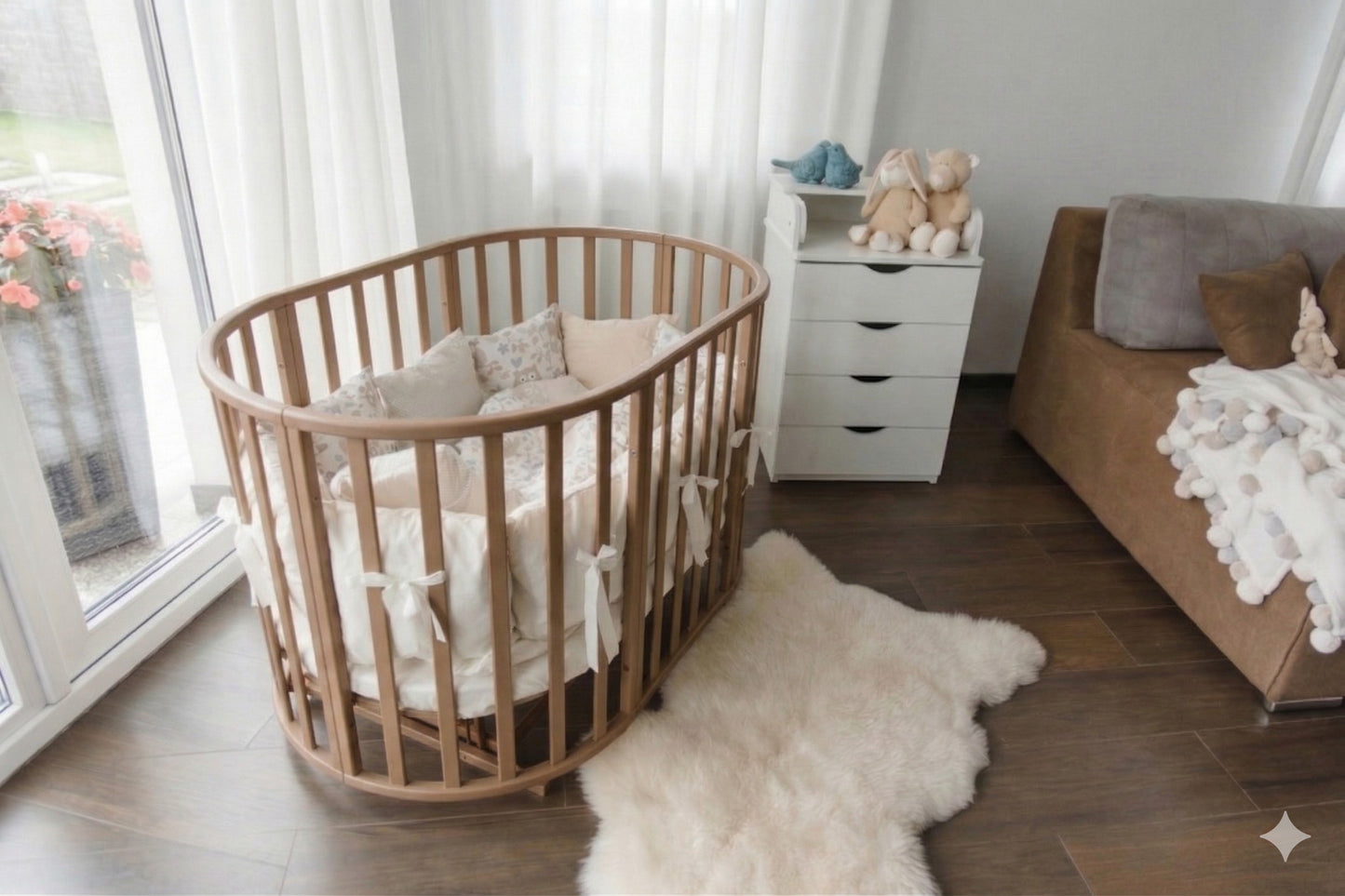 Cappuccino wood crib in bedroom setting next to parent bed as bedside sleeper