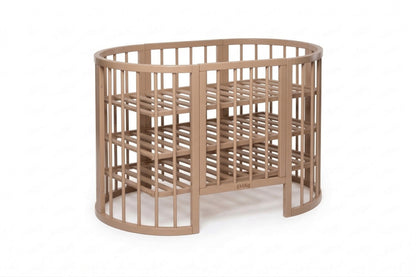 OLIN round crib with removable side and visible slatted mattress base support