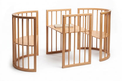 Three wooden crib sections connected showing expandable playpen configurations