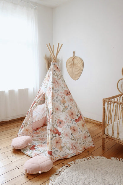 Flower Power teepee tent in nursery room with wooden furniture and natural decor