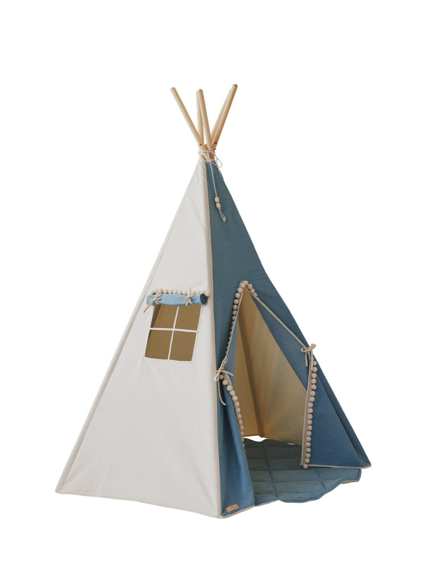 Product shot of jeans teepee tent with white and blue cotton fabric and pom pom trim on white background