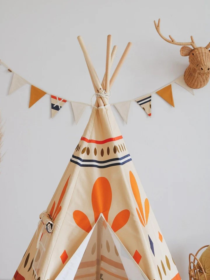 Side view of Native Vibe teepee tent highlighting orange, navy, and cream geometric tribal pattern details
