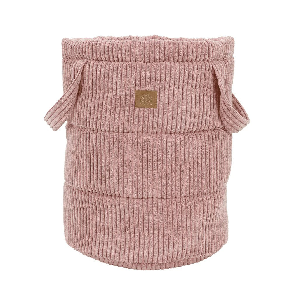 Empty powder pink corduroy toy storage basket with rope handles and ribbed texture