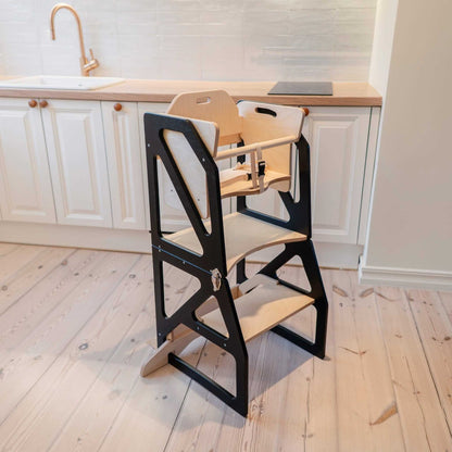Black and natural wood kitchen tower with chair components