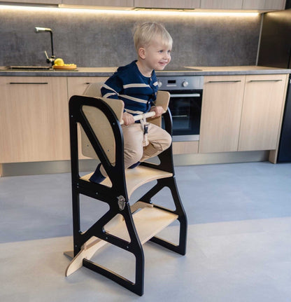 Gray kitchen tower with attached table showing high chair back detail