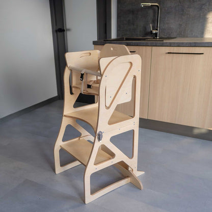 Natural wood kitchen tower with attached table, flat pack shown assembled