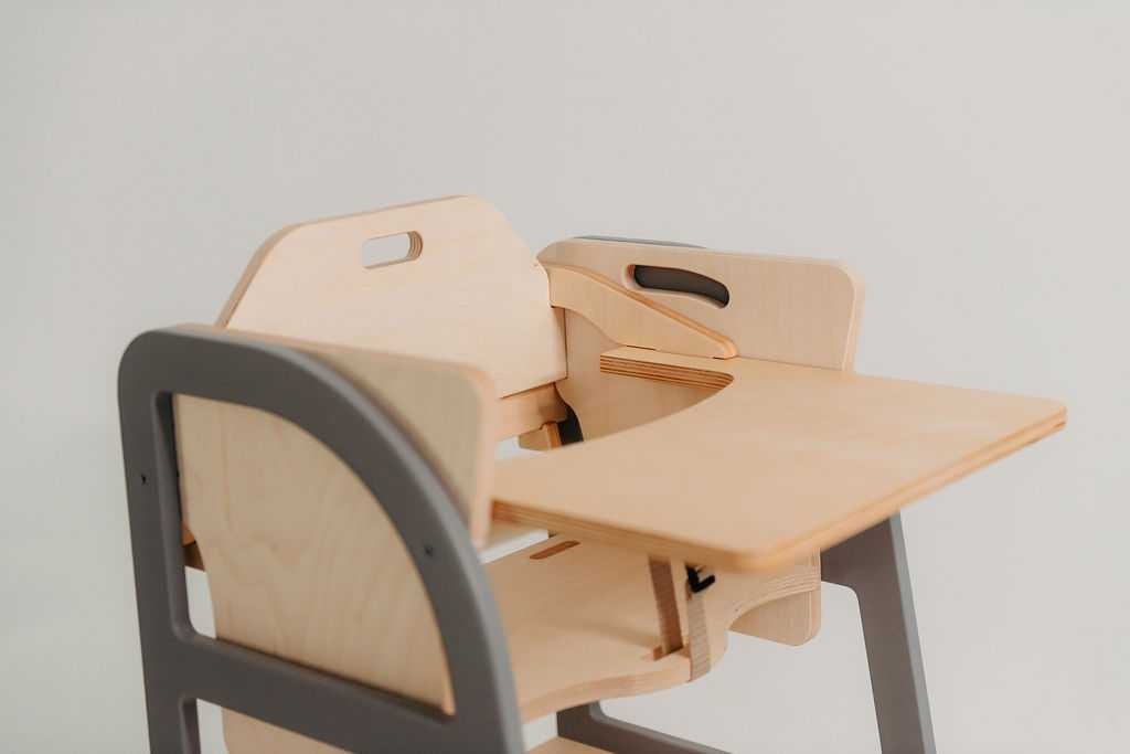 Wooden table and chair components with storage handles displayed separately