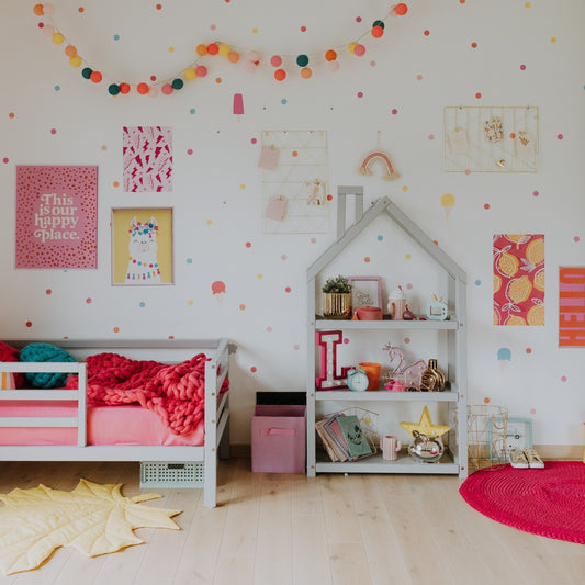 House-shaped Montessori shelf styled in colorful kids bedroom with toys and books
