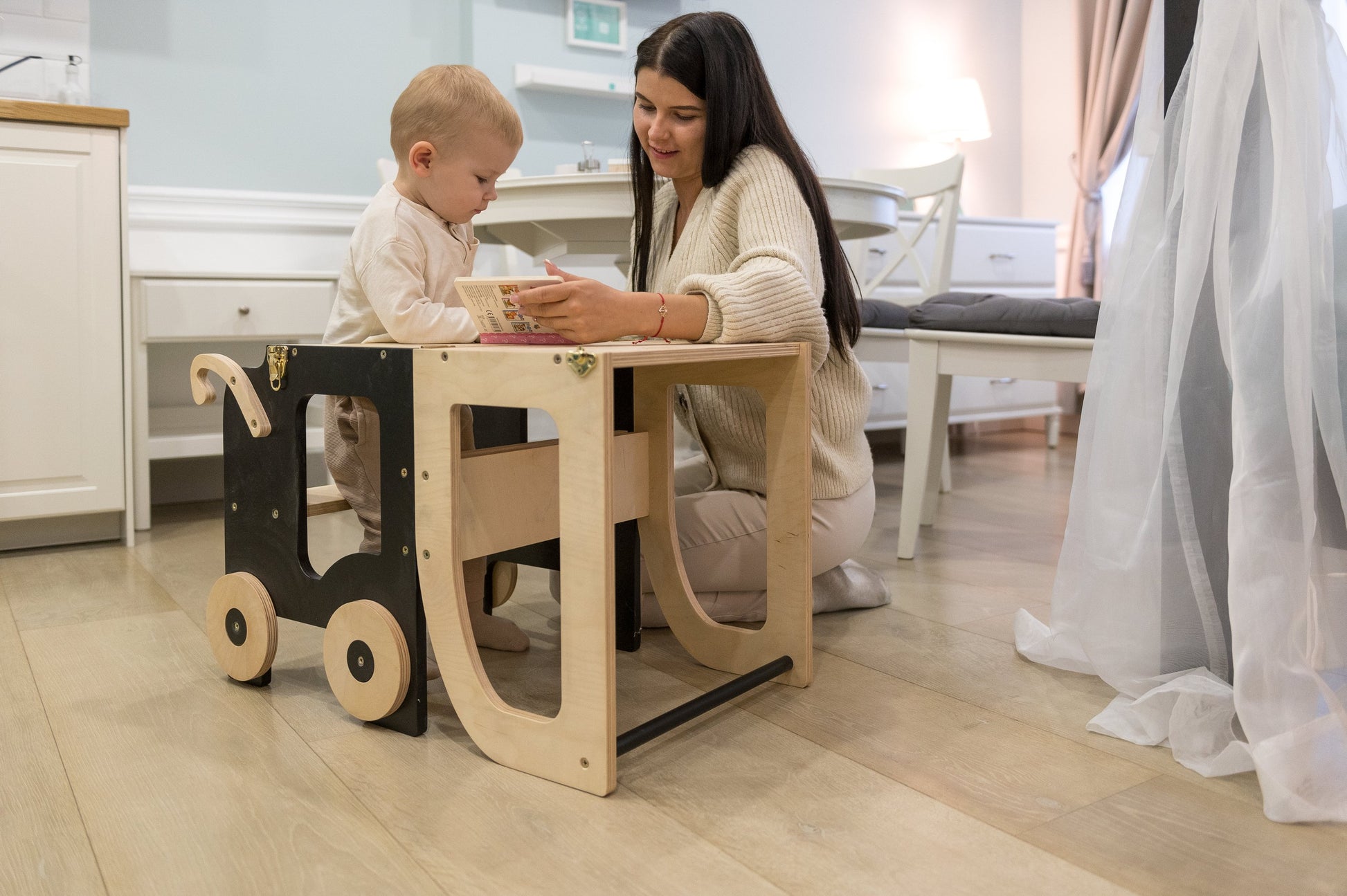 Family-scl convertible learning tower in white finish next to kitchen countertop