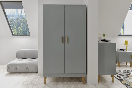 Grey Kubi kids wardrobe in minimalist bedroom with oak legs and matching nightstand