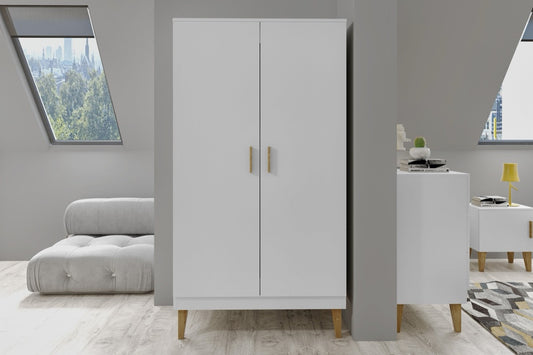 White Kubi kids wardrobe in modern bedroom with oak legs and gray upholstered bed