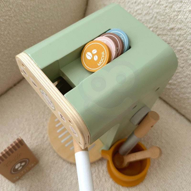 Overhead shot showing wooden coffee machine with stacked coffee disks in top storage compartment