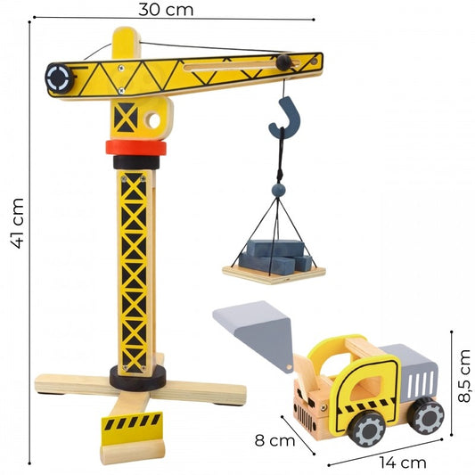 Wooden construction crane with rotating arm, 42 cm tall, lifting gray cargo sling with yellow dump truck below